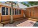 Orange house exterior with a patio and a decorative door at 507 Lakeshore Dr, Eustis, FL 32726