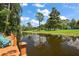 Relaxing dock overlooking a calm waterway and park at 507 Lakeshore Dr, Eustis, FL 32726