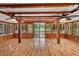 Spacious sunroom with hardwood floors, abundant natural light, and access to backyard at 507 Lakeshore Dr, Eustis, FL 32726