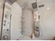 Modern bathroom with double shower heads and built-in shelving at 507 Lakeshore Dr, Eustis, FL 32726