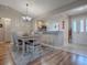 Light and airy dining room with a view to the kitchen at 616 Cokesbury Dr, The Villages, FL 32162