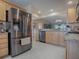 Modern kitchen, stainless steel appliances, light wood cabinets at 616 Cokesbury Dr, The Villages, FL 32162