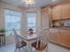 Charming kitchen breakfast nook with wood table and chairs at 616 Cokesbury Dr, The Villages, FL 32162