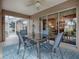 Enjoy dining alfresco in this screened patio with a ceiling fan at 616 Cokesbury Dr, The Villages, FL 32162