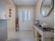 Bright entryway with decorative console table and mirror at 616 Cokesbury Dr, The Villages, FL 32162