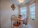 Charming dining area with wooden table and chairs at 616 Cokesbury Dr, The Villages, FL 32162