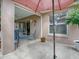 Relaxing screened patio area with seating and a partial view of the backyard at 616 Cokesbury Dr, The Villages, FL 32162