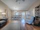 Open concept living and dining area with hardwood floors at 616 Cokesbury Dr, The Villages, FL 32162