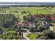 Impressive estate home nestled on a spacious lot, boasting beautiful landscaping and scenic views at 15008 Pendio Dr, Bella Collina, FL 34756