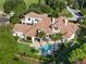Luxury home with a large pool and expansive backyard, perfect for entertaining at 15008 Pendio Dr, Bella Collina, FL 34756