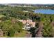 Luxury home nestled in lush trees, with a private pool and amazing lake views at 15008 Pendio Dr, Bella Collina, FL 34756