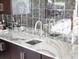 Modern bar sink with marble countertop and sleek faucet at 15008 Pendio Dr, Bella Collina, FL 34756