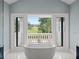 Bathroom with freestanding tub and access to a balcony at 15008 Pendio Dr, Bella Collina, FL 34756