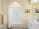 Bathroom with a shower/tub combo and double vanity at 15008 Pendio Dr, Bella Collina, FL 34756