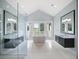 Luxurious bathroom with a freestanding tub and walk-in shower at 15008 Pendio Dr, Bella Collina, FL 34756