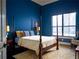 Elegant bedroom with a four-poster bed and a view at 15008 Pendio Dr, Bella Collina, FL 34756