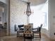 Charming breakfast nook with stone fireplace and a round table at 15008 Pendio Dr, Bella Collina, FL 34756
