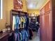 Large walk-in closet with custom built-ins and plenty of storage at 15008 Pendio Dr, Bella Collina, FL 34756