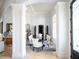 Elegant dining room with a formal table setting, highlighted by a beautiful rug at 15008 Pendio Dr, Bella Collina, FL 34756