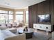 Modern Gathering room showcasing a sleek media wall and comfortable seating at 15008 Pendio Dr, Bella Collina, FL 34756