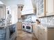 Gourmet kitchen boasts stainless steel appliances and granite countertops at 15008 Pendio Dr, Bella Collina, FL 34756