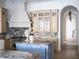 Open kitchen with a large island, custom cabinetry, and granite countertops at 15008 Pendio Dr, Bella Collina, FL 34756