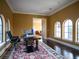 Home office with built-in desk and plenty of natural light at 15008 Pendio Dr, Bella Collina, FL 34756