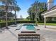 Resort-style pool with spa, fire pit, and expansive patio at 15008 Pendio Dr, Bella Collina, FL 34756