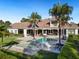 Expansive pool and spa surrounded by lush landscaping and patio at 15008 Pendio Dr, Bella Collina, FL 34756