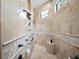 Spa-like shower with multiple shower heads and built-in seating at 15008 Pendio Dr, Bella Collina, FL 34756