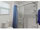 Clean bathroom with a shower/tub combo and blue accents at 736 Jones Ln, The Villages, FL 32163