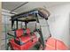 Garage with golf cart and storage at 736 Jones Ln, The Villages, FL 32163