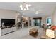 Open living area with a view into the kitchen and access to the outdoors at 736 Jones Ln, The Villages, FL 32163