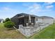 Screened patio with paver stones and seating area at 736 Jones Ln, The Villages, FL 32163