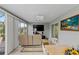 Sunroom with TV and comfortable seating at 736 Jones Ln, The Villages, FL 32163