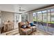 Sunroom with seating area and dining table at 736 Jones Ln, The Villages, FL 32163