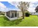 Mobile home exterior with screened porch at 1725 Pebble Beach Ln, The Villages, FL 32159