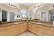 Large bathroom with granite countertops and double sinks at 3401 Fairfield St, The Villages, FL 32162