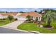 Single-story home with a landscaped yard and paver driveway at 3401 Fairfield St, The Villages, FL 32162