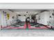 Spacious garage with overhead storage and epoxy floor at 3401 Fairfield St, The Villages, FL 32162