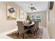 Dining room with wood table, neutral chairs and rug at 3401 Fairfield St, The Villages, FL 32162