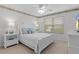 Bedroom with white furniture and a ceiling fan at 3401 Fairfield St, The Villages, FL 32162