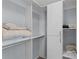 Spacious walk-in closet with ample shelving and hanging space at 3401 Fairfield St, The Villages, FL 32162