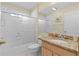 Clean bathroom with tub shower combo and granite vanity at 3401 Fairfield St, The Villages, FL 32162