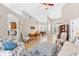 Spacious living area with hardwood floors, comfortable seating, and views into adjacent rooms at 5515 Citation Ct, Lady Lake, FL 32159