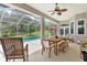 Inviting screened pool area with patio furniture and lush landscaping at 5515 Citation Ct, Lady Lake, FL 32159