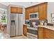 Modern kitchen with stainless steel appliances and granite countertops at 5515 Citation Ct, Lady Lake, FL 32159
