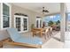 Relaxing patio with outdoor dining set and chaise lounge at 5515 Citation Ct, Lady Lake, FL 32159