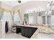 Elegant bathroom with a large vanity and a walk-in shower at 5515 Citation Ct, Lady Lake, FL 32159