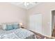 Spacious bedroom with a queen bed, wood floors, and built-in closet at 5515 Citation Ct, Lady Lake, FL 32159